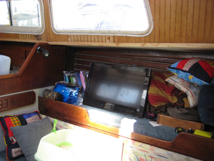 before we built our "entertainment center" -- everything in a pile in the pilot's berth