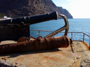 Old canons and anchors litter the wharf.