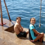 Drake and Phoebe enjoy the rope swing at the dinghy dock.