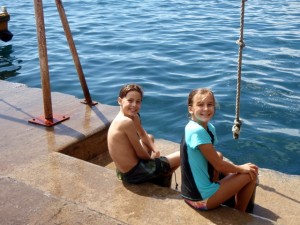 Drake and Phoebe enjoy the rope swing at the dinghy dock.